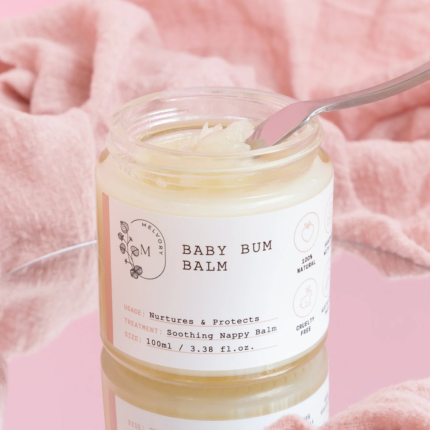 image of a glass jar of baby balm