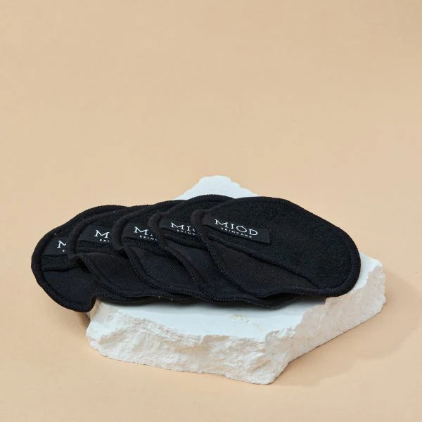 this is an image of bamboo cleansing pads on a white rock