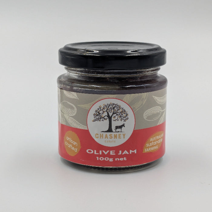 A jar of Chasney Estate Olive Jam with a label showing an olive tree and text that specifies the product name and weight of 100g net.