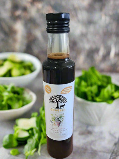 Bottle of olive oil with a label on a black background