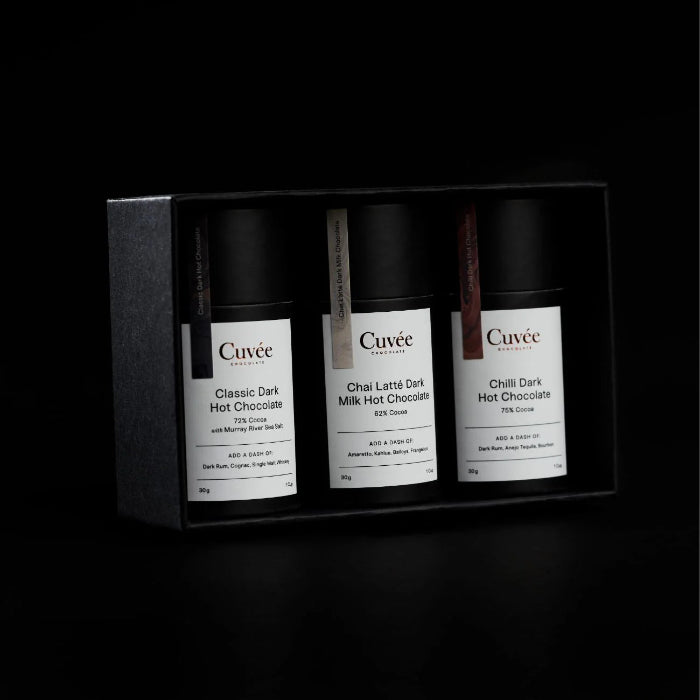 black container with 3 containers of hot chocolate varieties in there that look elegant and delicious, great for gifts