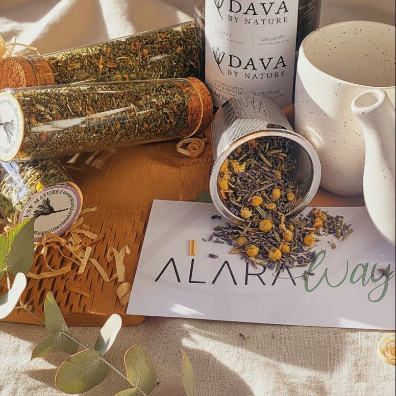 Dava by Nature Herbal products in Test Tubes and teapot and cup on a table with 'Alara Way' branding.