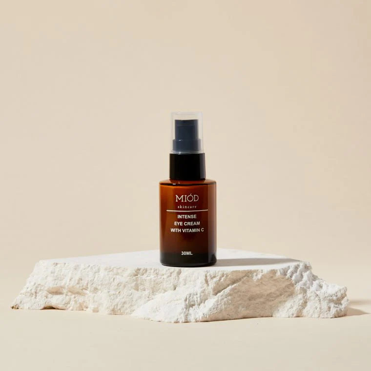 This is an image of intense eye cream with vitaminC on a rock, great for low-tox gifts