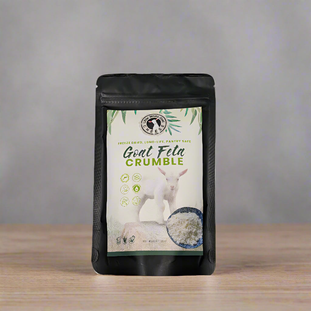 A packaged product labeled 'Goat Feta Crumble' by Little White, showing a white goat and crumbled cheese, indicating it is a food item.