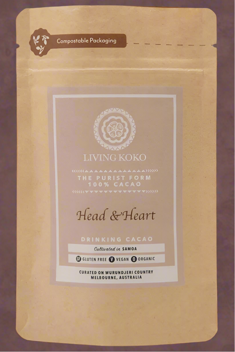 Packaging of Living Koko Head & Heart Drinking Chocolate 100g, with branding and product information displayed.