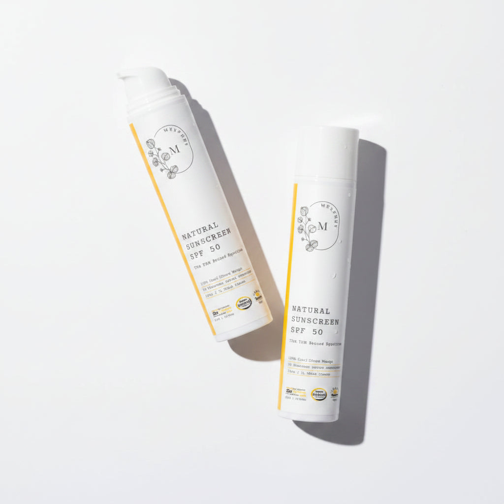 image of 2 sunscreen bottles in water and sand