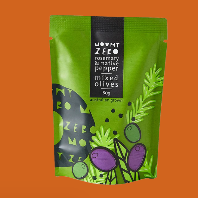 Green package of Mount Zero rosemary and native pepper mixed olives on an orange background