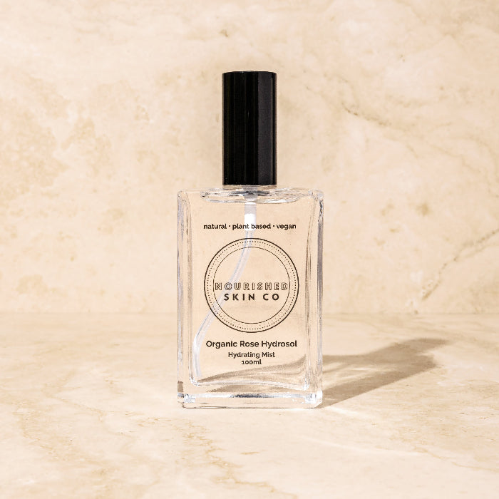image of glass bottle with organic rose hydrating mist