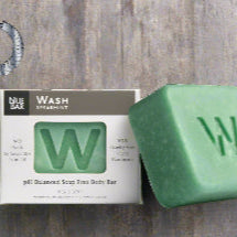 Green soap bar with 'W' logo next to its packaging on a white background, featuring the 2022 Organic Beauty Award winner badge.