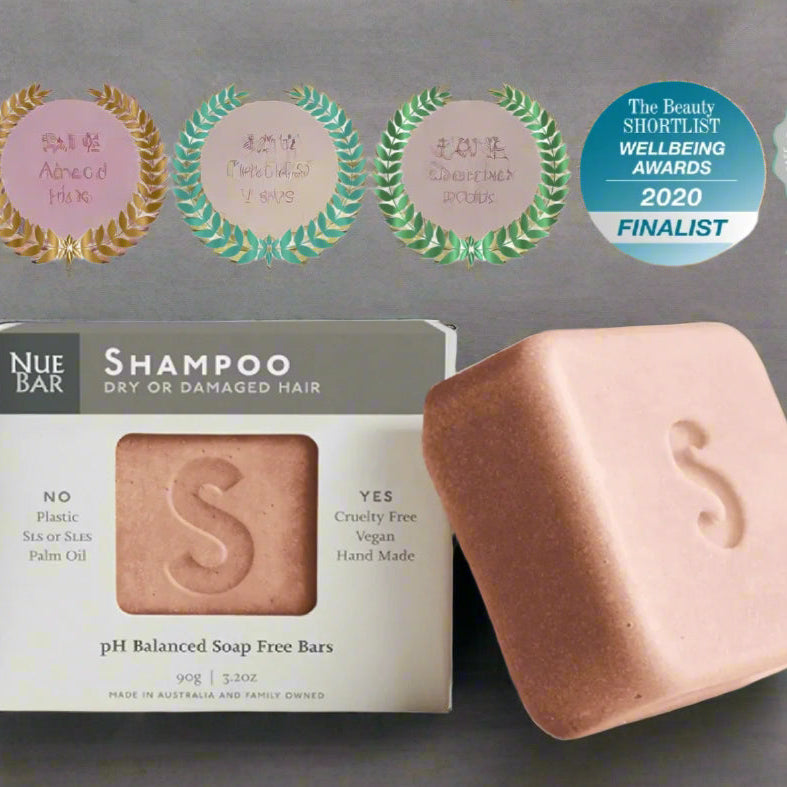 Nue Bar shampoo bar with packaging and awards on a white background