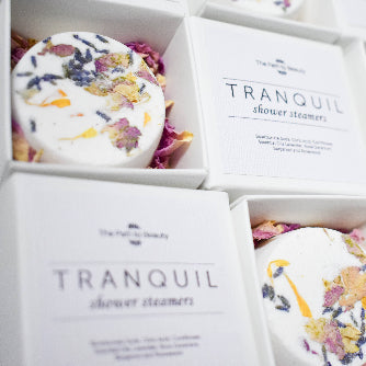 Image of flowers shower steamers and bath bombs for low -tox relaxation.Great for Gifts and Self Care.