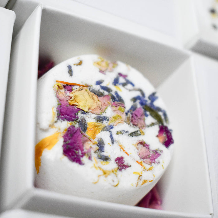 Image of flowers shower steamers and bath bombs for low -tox relaxation.Great for Gifts and Self Care.