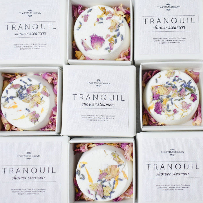 Image of flowers shower steamers and bath bombs for low -tox relaxation.Great for Gifts and Self Care.