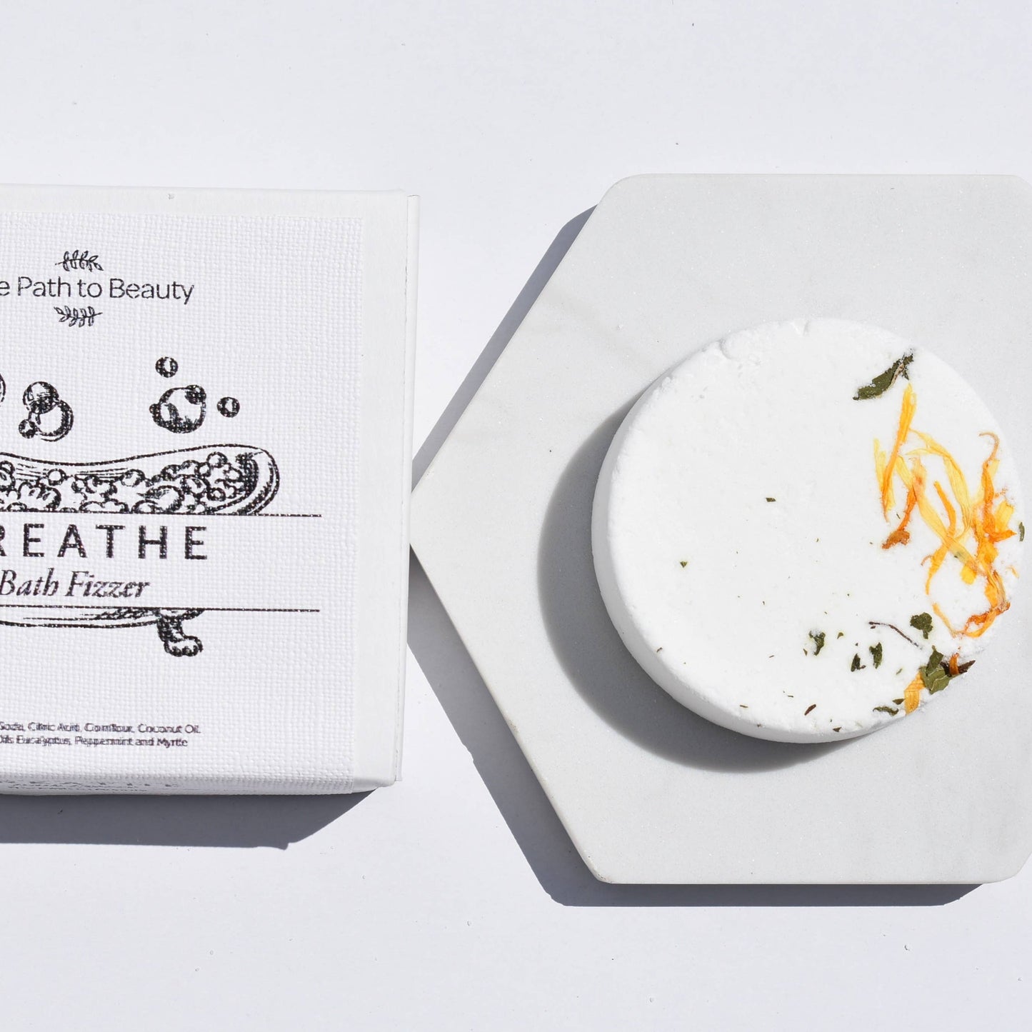 Single bath fizzers with floral designs on the packaging, labeled 'The Path to Beauty - Breathe. Presented on a white background with a decorative border.