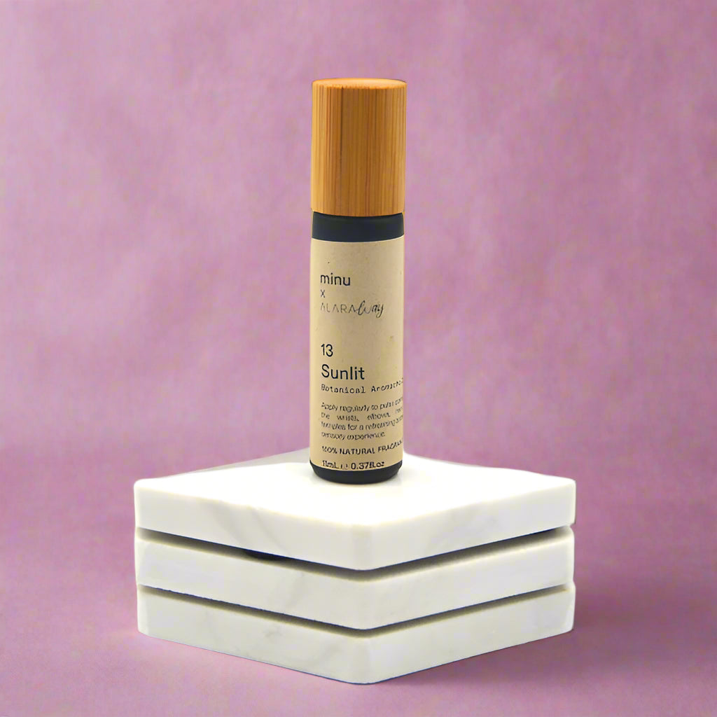 an image of a roll on glass bottle of aromachology scents