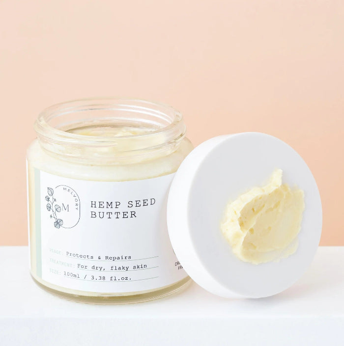 this is a photo of a jar of hemp seed butter with the lid to the side