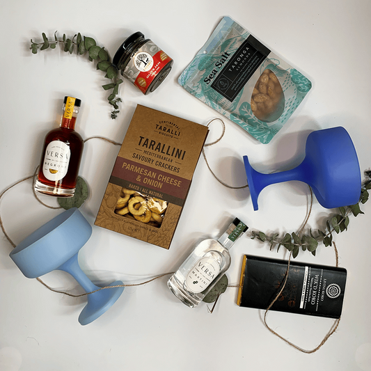 Birthday celebration hamper with Versa and cocktail cups,savory crakers sea salt almonds ,living koko  chocolate and olive paste 