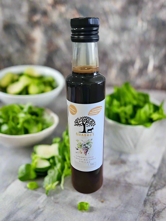 Bottle of olive oil with a label on a black background