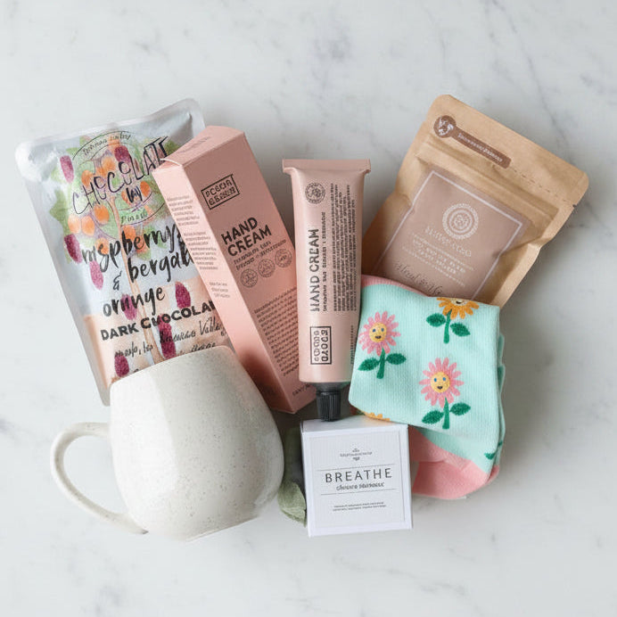 Collection of low tox items - drinking chocolate ,mugs, noosa basics hand cream ,peter M chocolate and shower steamer.