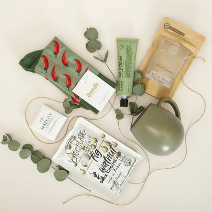 Collection of low tox items - drinking chocolate ,mugs, noosa basics hand cream ,peter M chocolate and shower steamer.