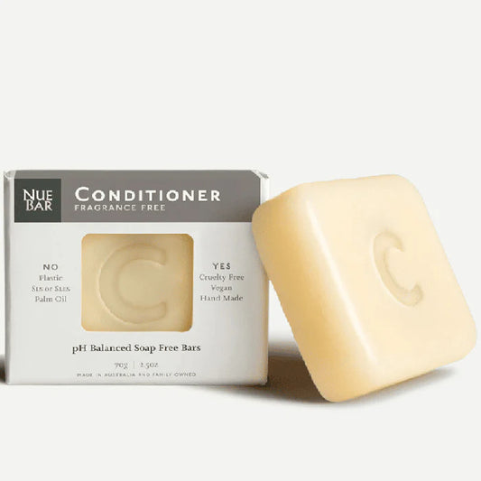 A packaged solid conditioner bar next to its box, labeled as fragrance-free with organic extra virgin olive oil.
