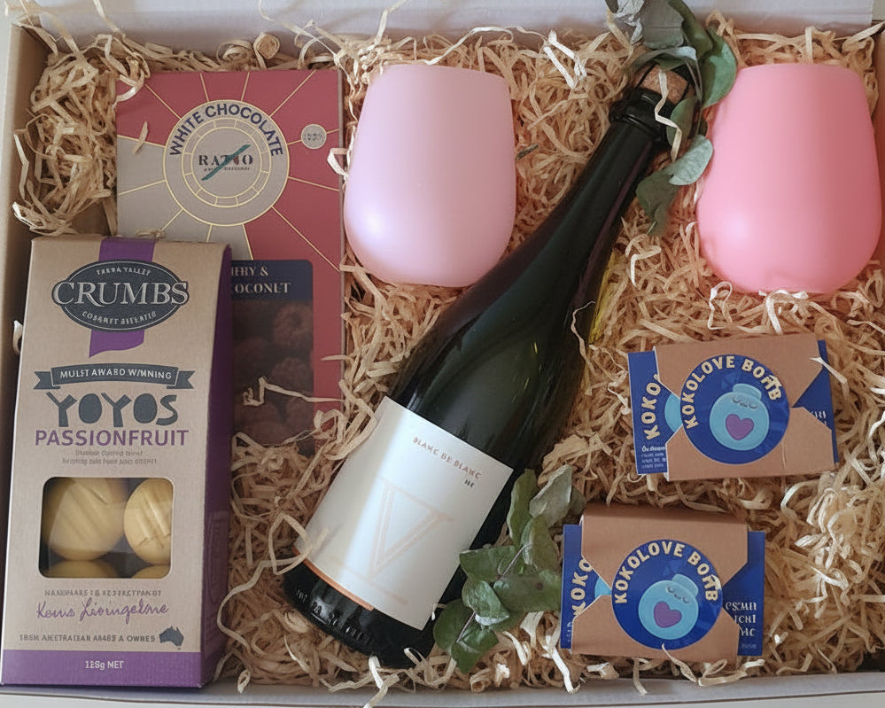 Hamper box with Wine ,cups,chocolate ,biscuits and love bombs