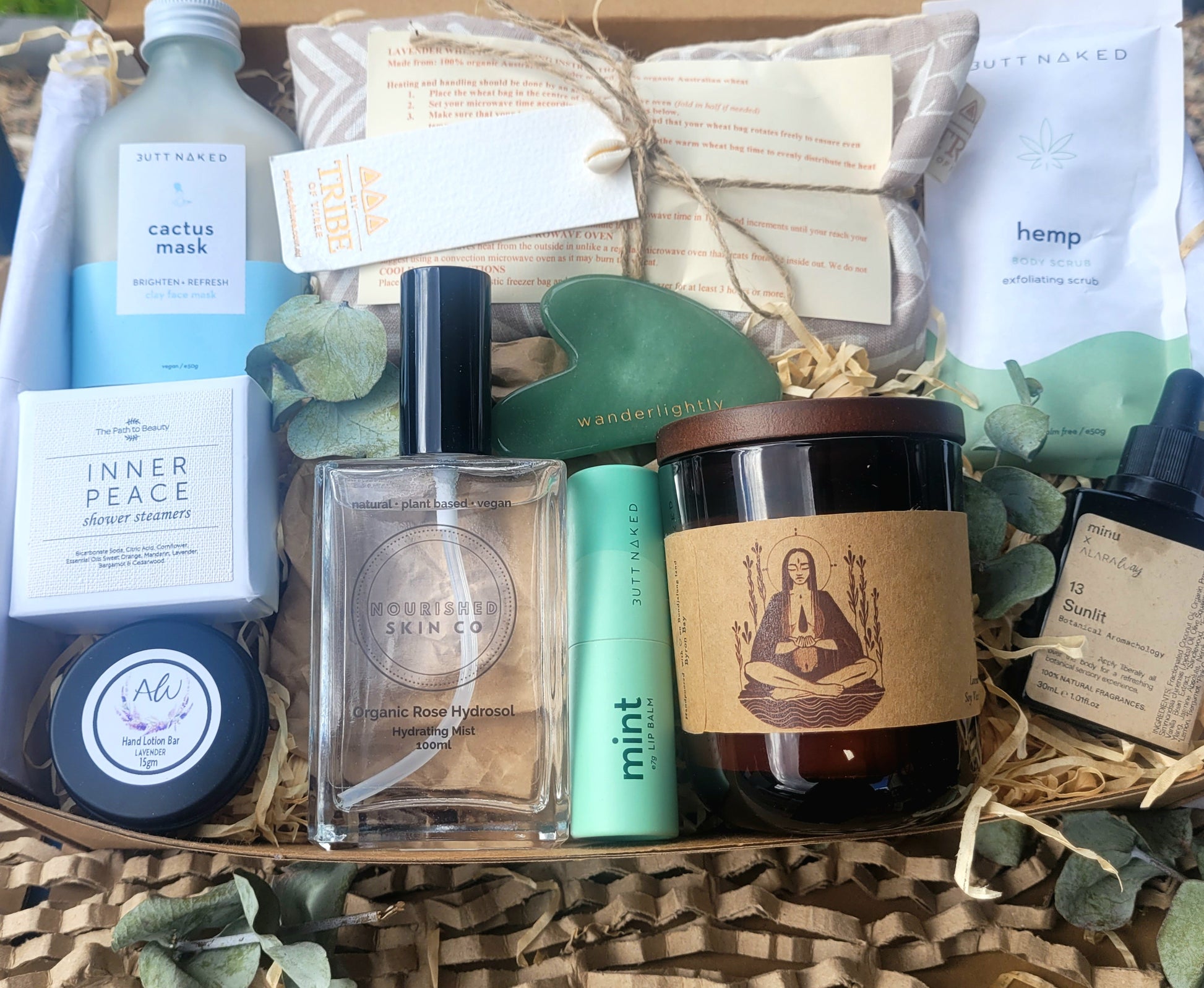 Assorted beauty and wellness products in a box with visible branding.