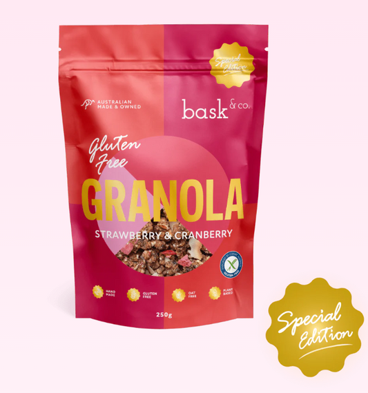 Bag of Bask & Co. strawberry and cranberry granola with a pink and red design.