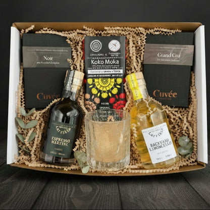 Gift box with various items including Espresso Martini, Backyard Limoncello and selection of low tox Chocolates with a gorgeous glass cup. 