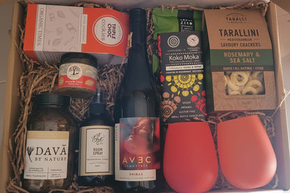 Gift box with wine, snacks, and other items