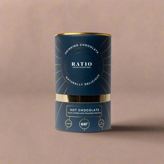 Dark blue packaging of Ratio hot chocolate with gold accents on a white background