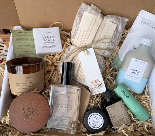 Assorted beauty products in a box with visible branding