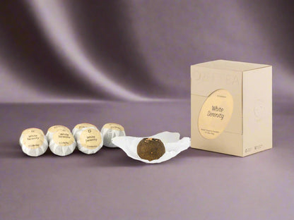 Truffles with packaging on a white background