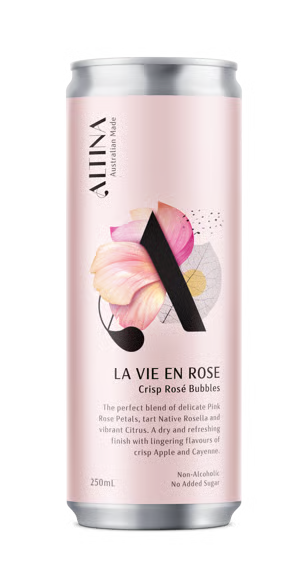 A 250ml aluminum can of Alina La Vie En Rose Crisp Rose Bubbles on a clean white background. The can features a light pink label with a large black letter 'A' overlaid on pink and yellow rose petals, and black text detailing the flavor and ingredients.