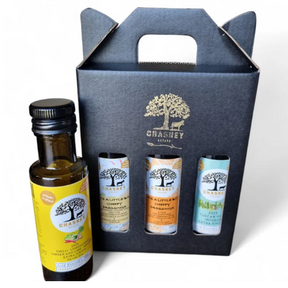 Set of Chasney olive oil bottles in a branded box on a white background