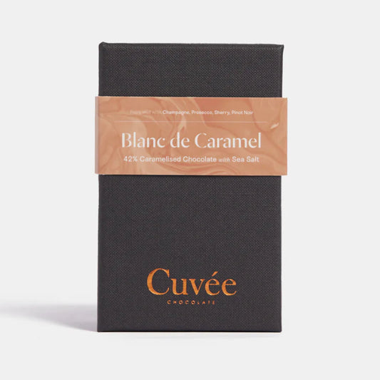 Black chocolate bar packaging with 'Cuveé' branding on a white background