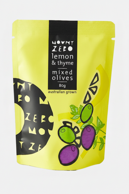 Yellow package of Mount Zero lemon & thyme mixed olives on a brown background