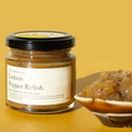 Jar of preserve with a spoonful on a yellow background