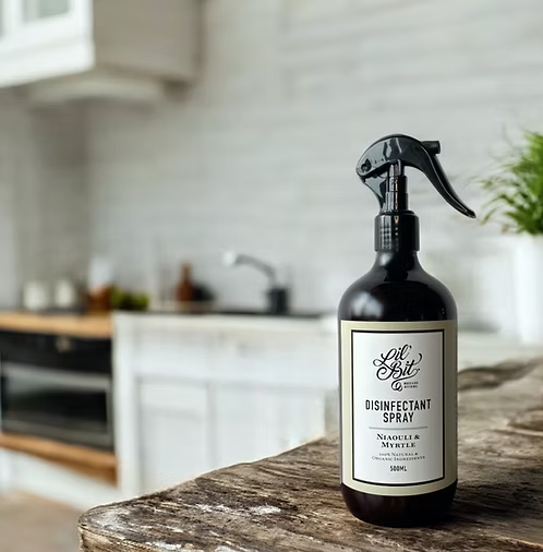 Disinfectant spray bottle on a kitchen counter with a blurred background