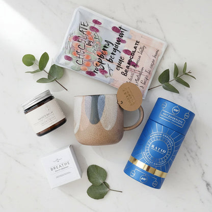 Gift set with a mug, drinking chocolate,  barossa valley chocolate ,moisturising cream and shower steamer.