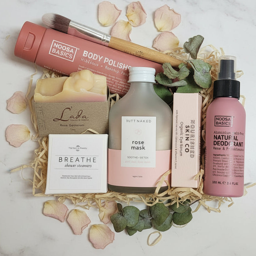 Collection of low tox skincare and beauty products in gift box