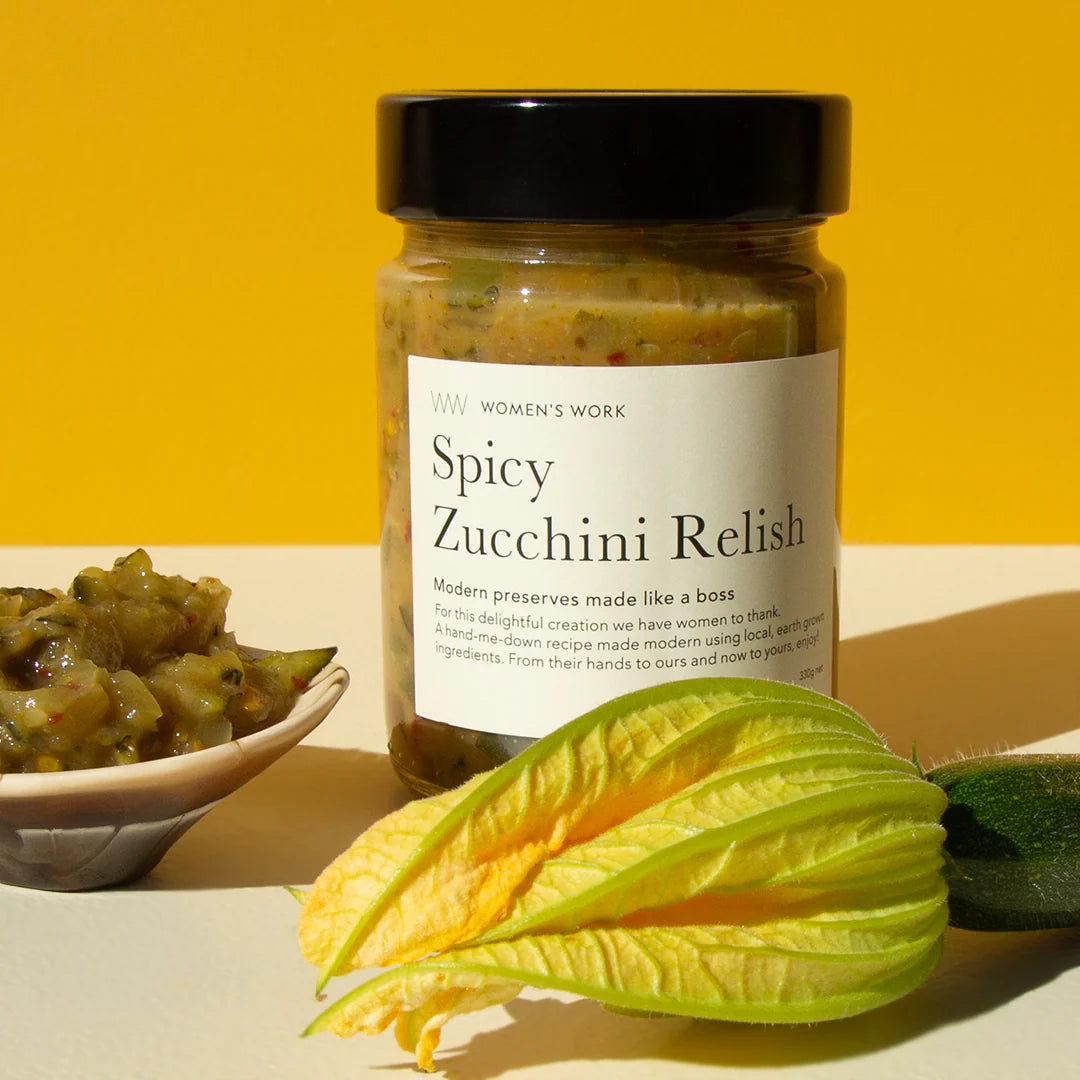 Jar of Spicy Zucchini Relish with a yellow background